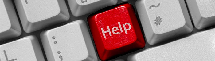 Help-knop op het toetsenbord dat een beeldspraak is voor de minimale IT vereisten bij CRM selectie